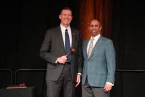 L to R: Jeff Samz, 2025 Board Chair for the Huntsville/Madison County Chamber, accepts the gavel from Sameer Singhal, 2024 Board Chair (Huntsville/Madison County Chamber)